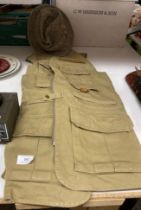 An Ortis khaki sleeveless hunting/fishing jacket size L and a Christie's London 'Robbie' all wool