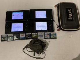 Pair of Nintendo DS Lites complete with one power supply and nine Super Mario Bros games,