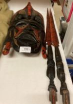 A James Kenya 1990 wood mask and two short spears (Saleroom location: V05)