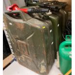 Three green metal 20L fuel/jerry cans - two with nozzles (saleroom location: Y01) Further