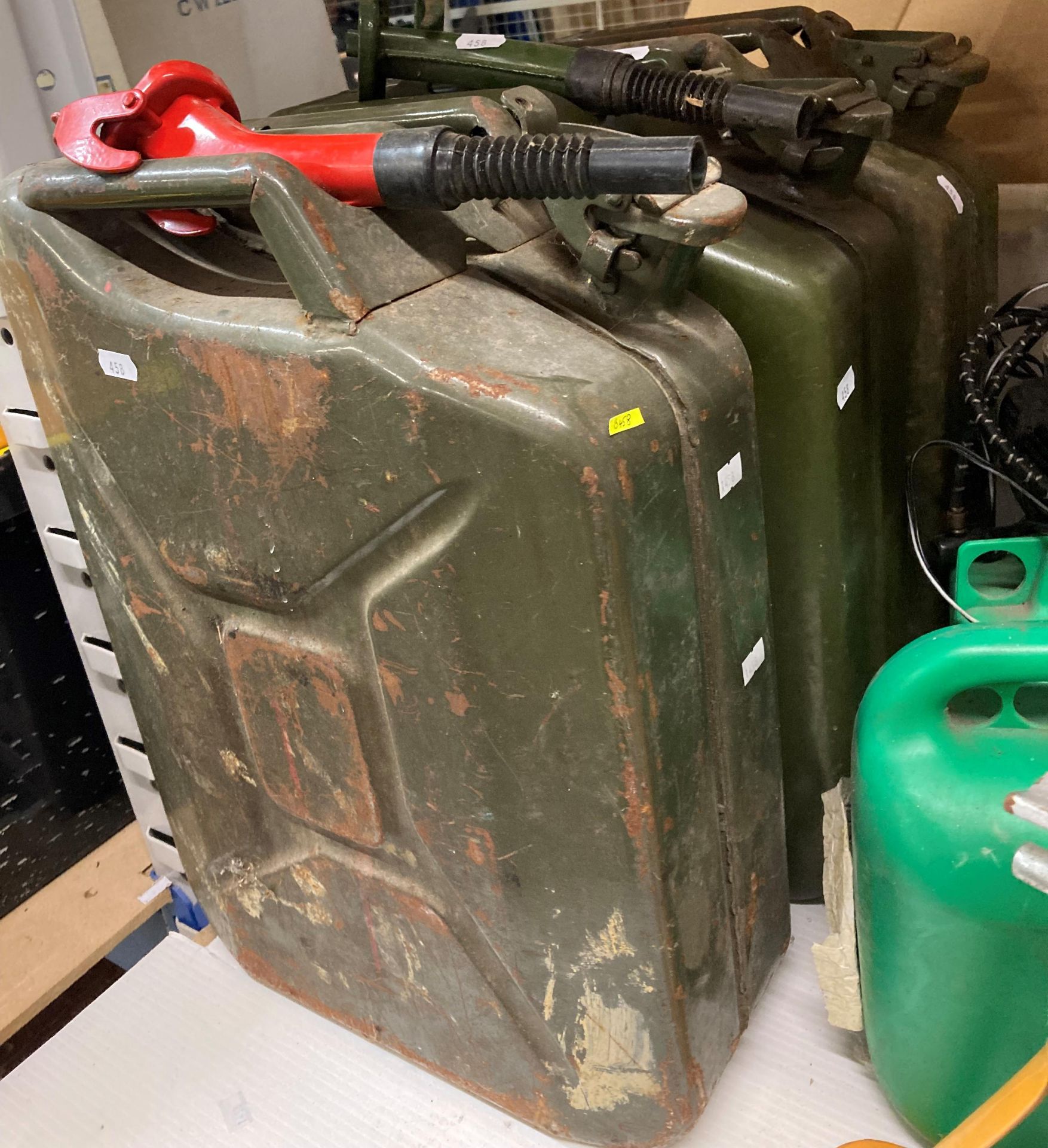 Three green metal 20L fuel/jerry cans - two with nozzles (saleroom location: Y01) Further