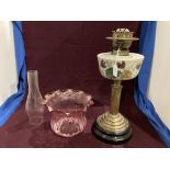 A Victorian brass column oil lamp with floral painted opaque bowl and shade in pink - total height
