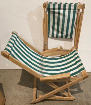 Pair of wooden deck armchairs with green and white striped material (saleroom location: MA4)