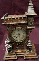 A small wood mantel clock in the form of a tower (28cm) (saleroom location: S3QC03)