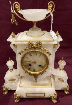 An onyx and gilt mantel clock surmounted with a two handled cup,
