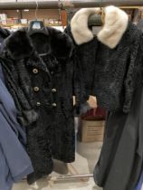 A Marshall & Snelgrove ladies Astrakan short coat with fur collar and a ladies black Astrakan long
