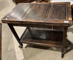 A stained wood drawer leaf tea trolley with undershelf 46 x 128cm when extended (saleroom location: