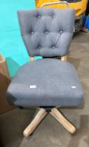 A grey fabric deep buttoned back office swivel chair on limed oak frame (saleroom location: MA4)
