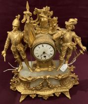 A green onyx and gilt finish figural mantel clock with French cavalry men in heroic pose - 42cm