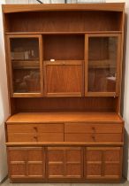 Mid century Nathan teak wall unit with a three door four drawer base section and a two glazed door