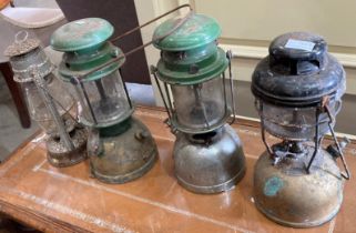 Four various paraffin storm lanterns (saleroom location: MA3)