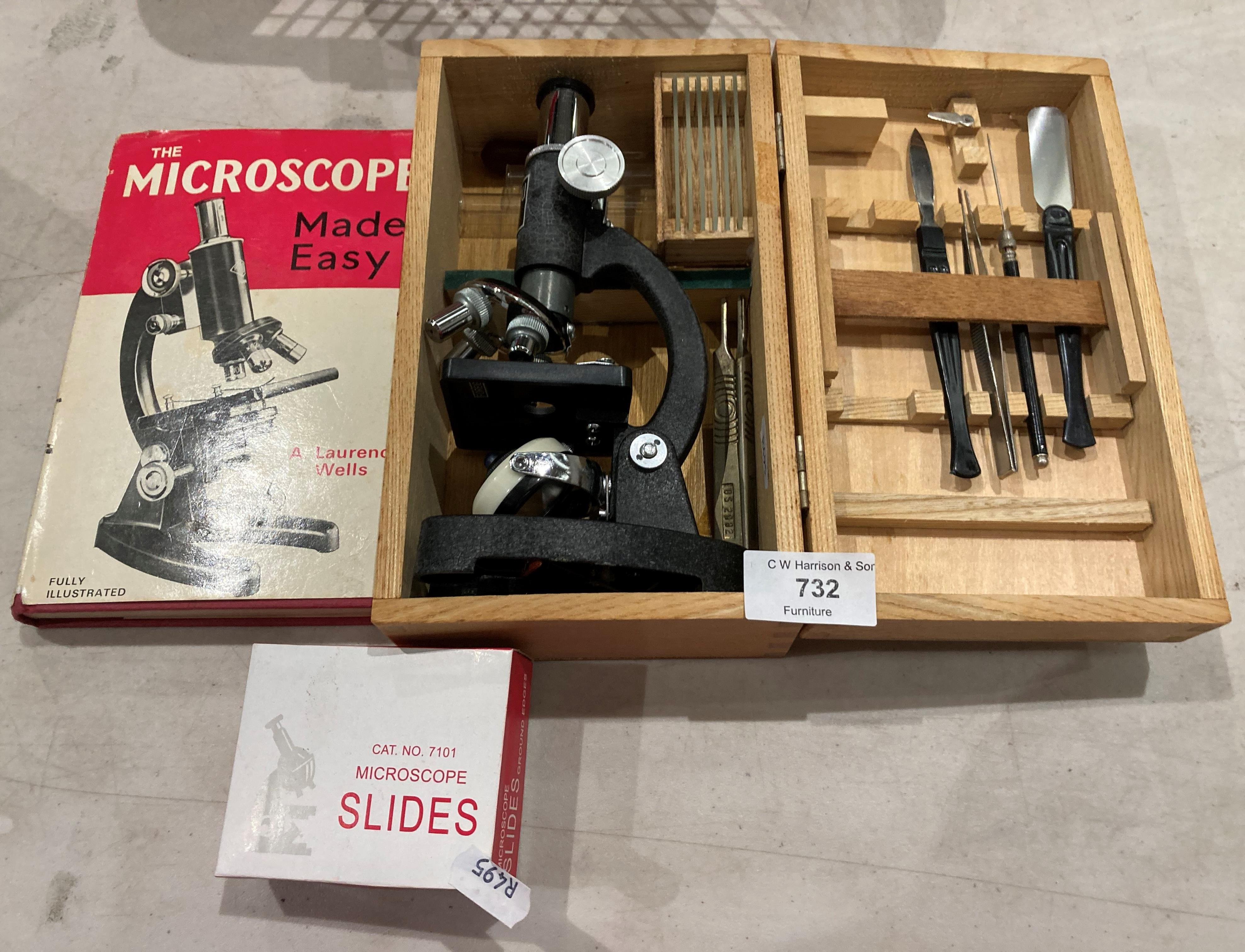 A Bijou children's microscope in box complete with book and a box of glass slides (Saleroom