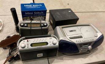 A Mini Stitch sewing machine (still boxed), a Roberts portable DAB radio,