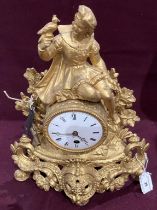 A gilt painted metal figural mantel clock - 32cm complete with key (saleroom location: S3QC04)