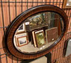 A walnut framed oval wall mirror 64 x 86cm (saleroom location: gallery)