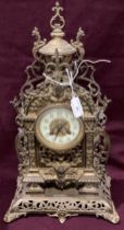 A gilt finish ornately decorated mantel clock - 46cm high complete with key (saleroom location: