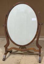 A mahogany framed oval swing-top toilet mirror (saleroom location: S1 CR)