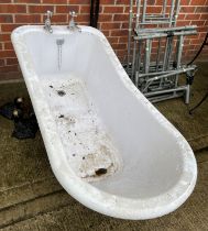 A composite roll top bath with chrome taps and black metal claw and ball feet (Saleroom location: