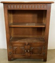 Small carved oak bookcase with single shelf over twin single carved doors 66 x 30 x 88cm high