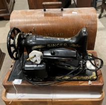 A Singer 240 sewing machine in portable case (saleroom location: S3QC02 floor)