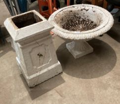 A white painted cast iron garden urn (56cm dia x 36cm high) mounted on a white painted terracotta