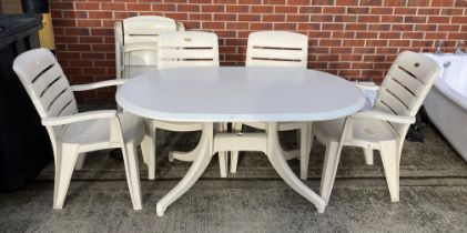 A Hartman plastic cream oval plastic outdoor D-ended patio table with grey speckled top,