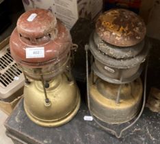 Two paraffin storm lanterns - sold as seen (saleroom location: R07) Further Information