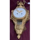 A brass wall clock with enamel dial signed Detouche,