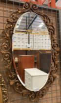Oval framed mirror in a gilt wooden foliage frame approx.