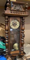 A mahogany cased Vienna style wall clock 110cm long complete with key (saleroom location: S3QC13)