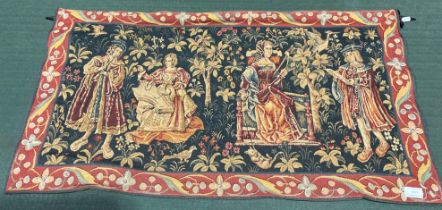 A small red and blue patterned tapestry wall hanging of ladies and courtiers 55 x 98cm on metal