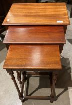 A mahogany nest of three tables (saleroom location: S3QC02 floor)