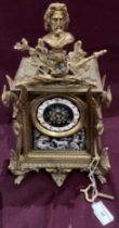 A gilt Continental style mantel clock with decorated front and side panels (crack to clock face) -