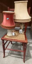 Two assorted marble table lamps and a wooden dining chair with wicker seat (saleroom location: MA7)
