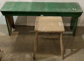 Green painted wooden bench 114cm long and a light brown painted wooden stool (saleroom location: