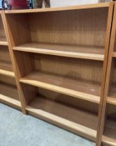 Pair of wood finish two shelf open front bookcases each unit 80 x 28 x 106cm high (saleroom