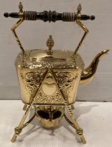 Victorian brass tilting spirit kettle with burner and with foliage design,