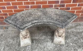 A curved concrete squirrel seat - 106cm long (saleroom location: outside)