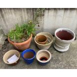 Seven various terracotta and glazed plant pots (saleroom location: outside)