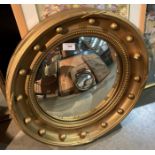 A gilt painted porthole style wall mirror - 54 x 54cm (saleroom location: gallery)