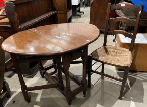 An oak oval gate leg dining table on block and turned supports with frieze drawer 84 x 110cm when
