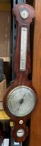 A walnut banjo-shaped barometer by Aylanbar? & Lambert,