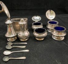 Seven assorted silver hallmarked condiment pots,