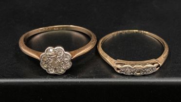 Two 18ct gold diamond rings (stones tested) - a flower design ring with central stone surrounded by