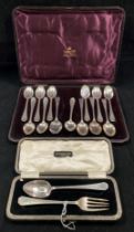A silver hallmarked fork and spoon engraved JEHF in fitted case,