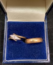 Two 18ct gold rings including wedding band (size M) and diamond engagement ring (size M) - total