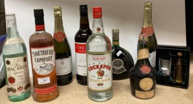 Nine items including a one litre bottle of Cockspur Barbadian Rum,