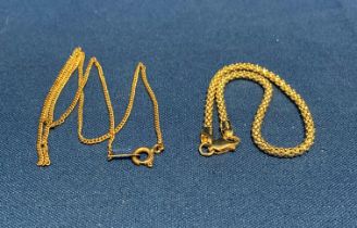 14ct gold bracelet (8" long and 3.8g) and a 9ct gold thin chain (16" long and 2.5g).