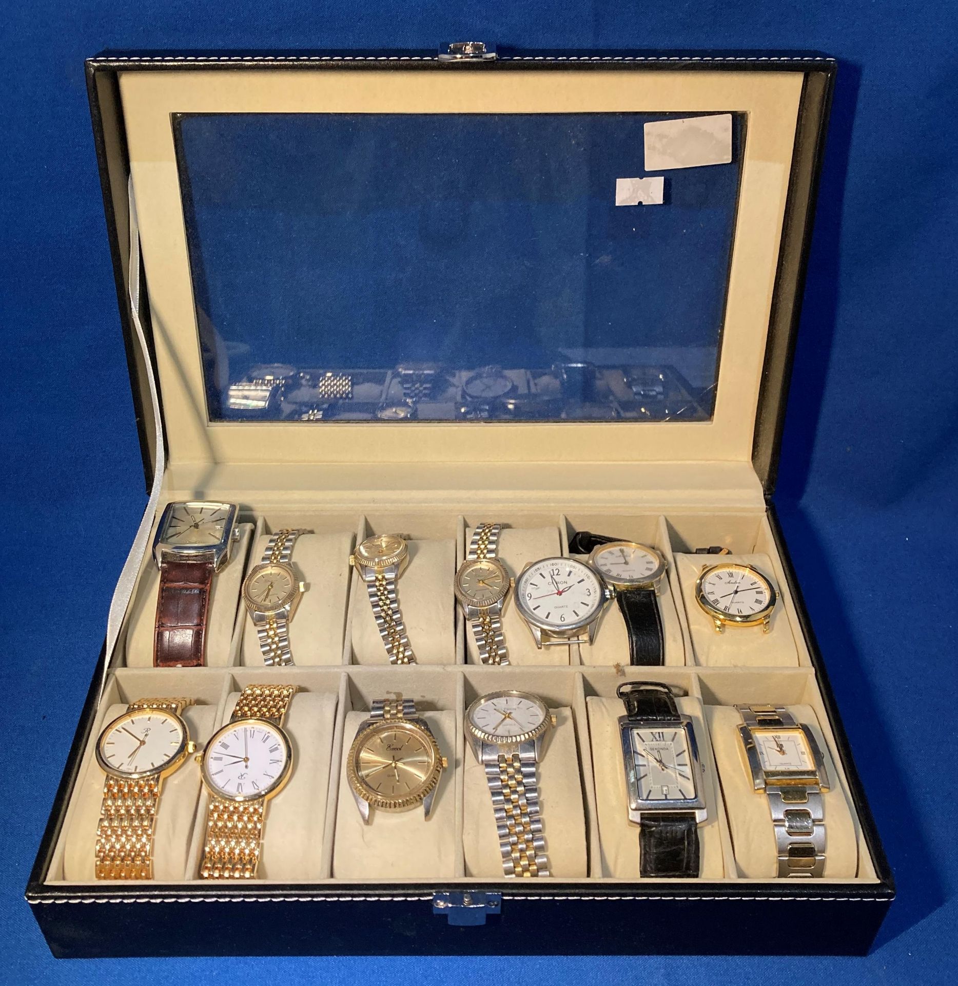 Black vinyl twelve-slot watch case and twelve ladies and gents watches including Sekonda, Citron,
