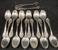 Set of twelve sterling silver hallmarked teaspoons by G M Co dated 1915 and matching sugar tongs -